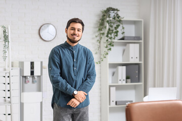Fototapeta premium Portrait of handsome man in office
