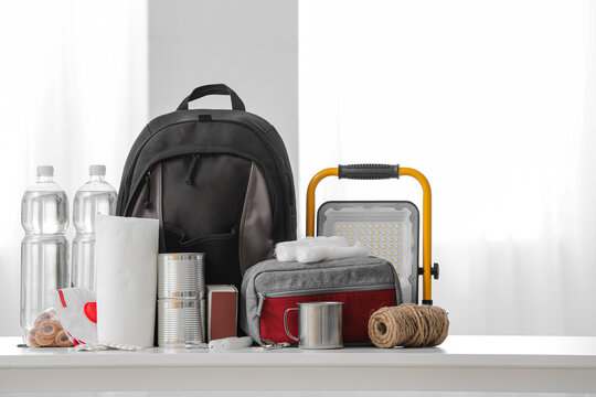 Emergency backpack with necessities on table in room