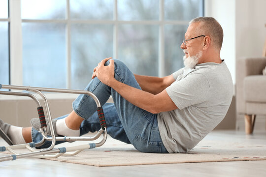 Injured senior man after fall with walker at home