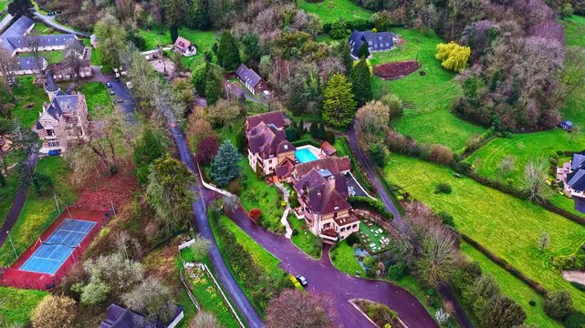 Aerial view of a few houses in the beautiful commune of Pennedepie in the department of Calvados, Normandy.
