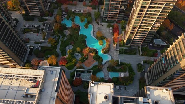 Drone view of residential buildings in China with swimming pool and garden in autumn