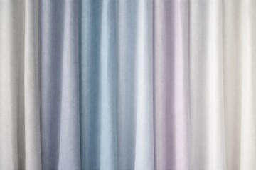 Obraz premium Soft gradient of pastel colored curtains in a row, creating a gentle ombre effect
