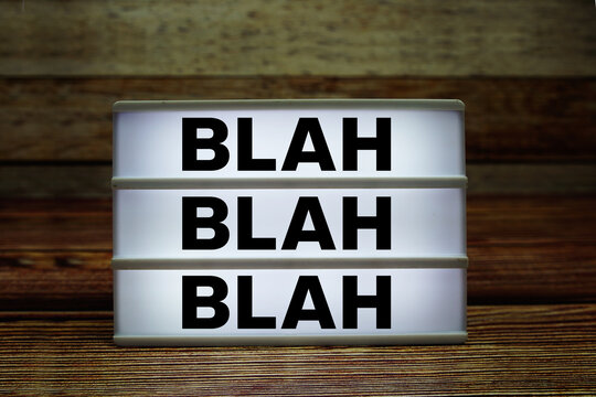 Lightbox with text "Blah Blah Blah" on wooden background