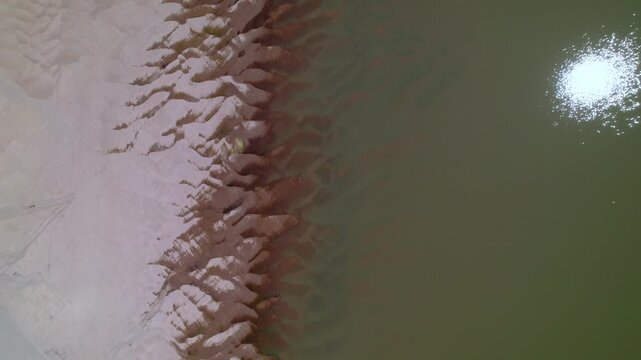 Aerial view of sadny coastline of the Mekong River.