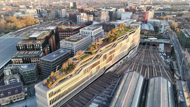 A rotating aerial dawn view of an office  building complex in London King's Cross.