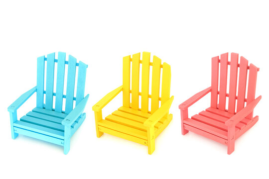 Primary colors wooden armchair furniture. Three chairs in blue, yellow, pink, on white background. Indoor outdoor colorful modern patio garden seating design. Side view.
