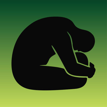 Silhouette of a person in fetal position against a green gradient background representing depression, sadness, and mental health awareness.