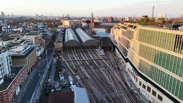 Aerial back approach to London King's Cross railway station with a huge building complex on the side.
