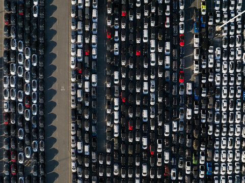 Vertical aerial of vehicle storage facility with thousands of cars