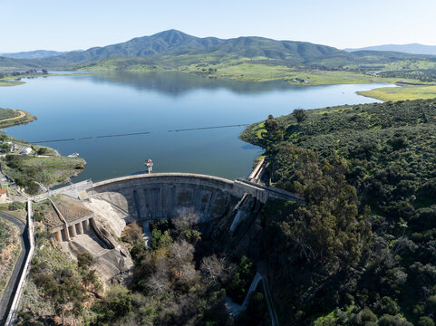 Expansive aerial view of dam infrastructure and processing area