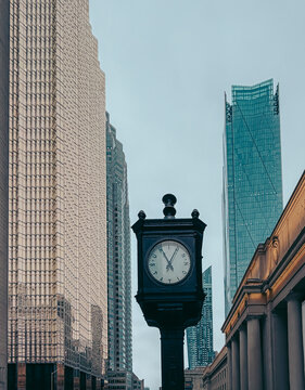 Clock and tall buildings outside Union Station in Toronto, Canada.