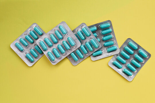 Blue capsules of Doxycycline in blister packs.