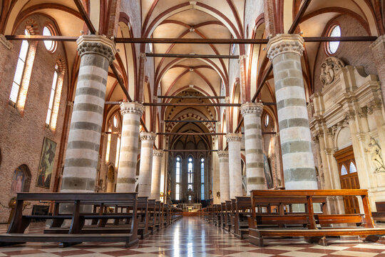 Interior of the Gothic Church of San Lorenzo in Vicenza featuring massive striped brick columns and elegant vaulted ceilings in Italy 08.01.2026