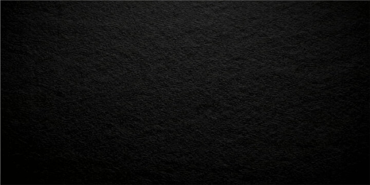 Textured black background, a study in contrasts, offering a versatile canvas for design. The rough, grainy surface plays with light and shadow, delivering a sense of depth and dimension.