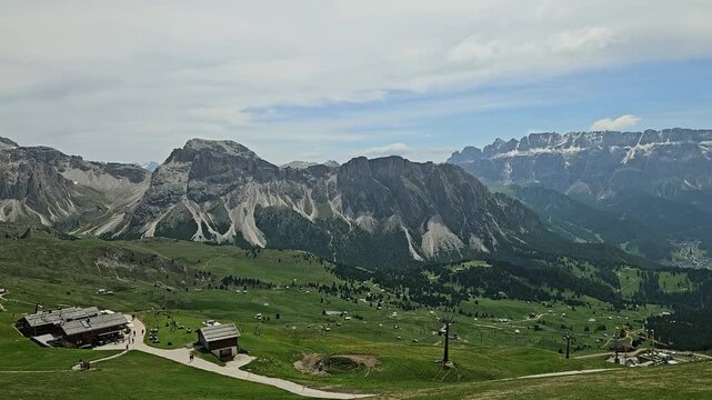 Meadows on the slopes of Odle - Geisler, with Seceda, Gruppo del Sella and Sassolungo. Italian Dolomites.