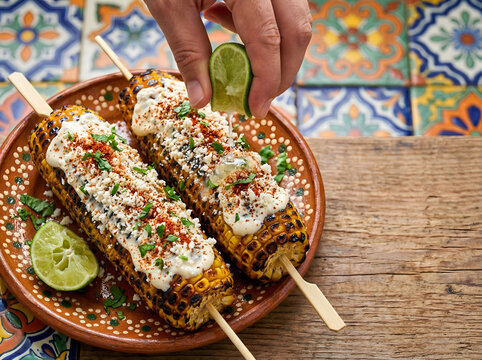 Grilled Mexican Elotes with Mayo Cotija Cheese Chili Powder and Lime