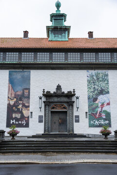 Bergen, Norway - July 7, 2024: Historic facade of the KODE art museum featuring banners of Edvard Munch and Nikolai Astrup exhibitions at the Rasmus Meyer Collection entrance