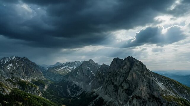 Dramatic mountain range landscape under stormy overcast sky
