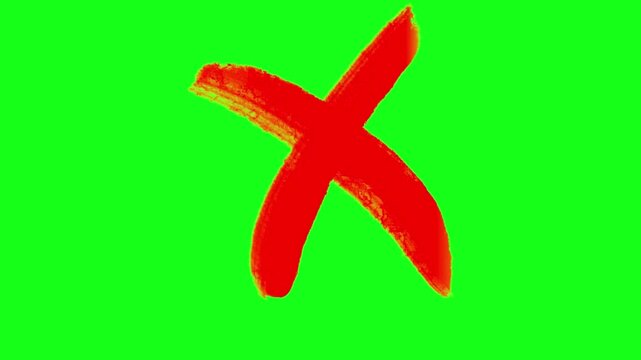 Red hand painted cross mark and x symbol on chroma key green screen background for vfx