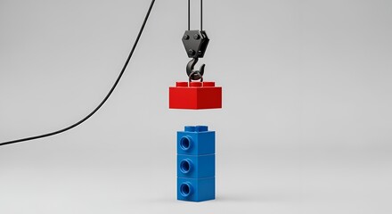 Obraz premium Lego bricks being lifted by hook red brick blue brick