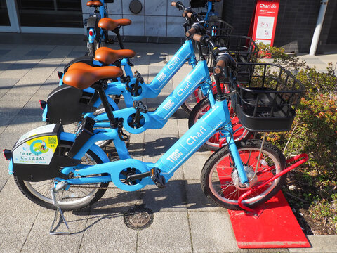 TOKYO, JAPAN - March 28, 2026: A row of Chari rental e-bicycles parked outside an apartment building in Tokyo's Sumida Ward.