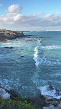 4k 60p vertical footage of stunning turquoise waters on Arniston&rsquo;s beautiful Overberg coastline with sand dunes visible in the background. Western Cape, South Africa. Iconic, remote coastal serenity.