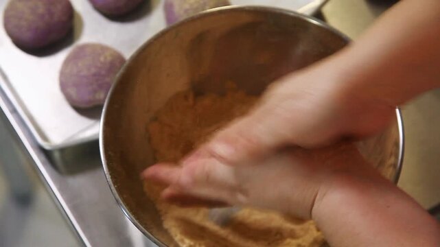 Filipino bread called Ube cheese pandesal being prepared for baking.