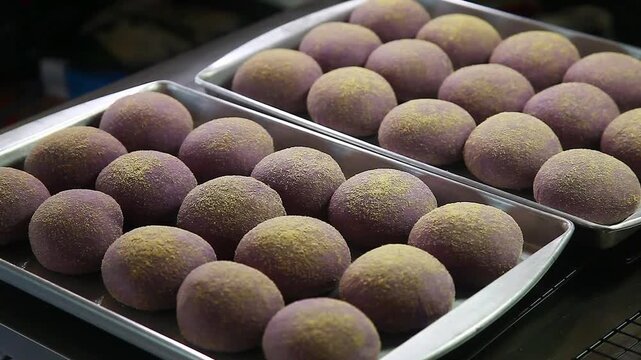 Freshly baked Filipino bread called Ube cheese pandesal