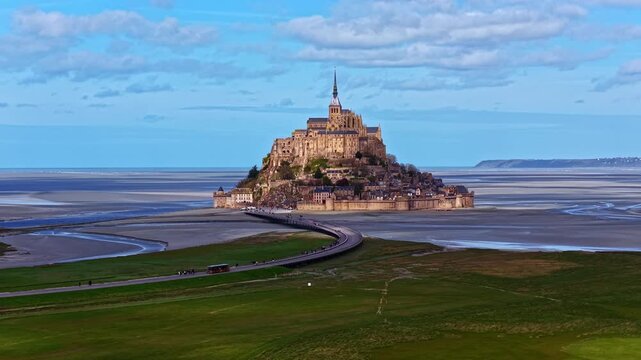Mont Saint Michel island commune and bay at low tide in Normandy