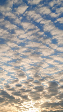 Blue sky with white puffy clouds, beautiful sky background texture. Clean air and clouds