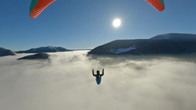 Dreamy Paragliding Flight Above Foggy Clouds at Sunrise, Freedom of Free Flying