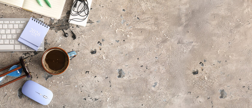 Cup of coffee, calendar, computer mouse and keyboard with hourglass on grey grunge background with space for text