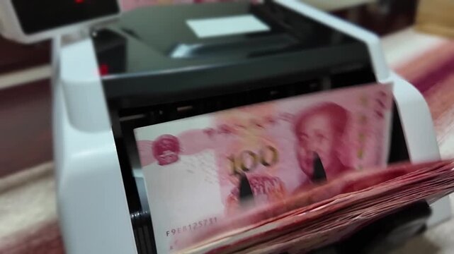 Slow motion of bill counting machine - Chinese Renminbi - RMB - Chinese Yuan - CNY