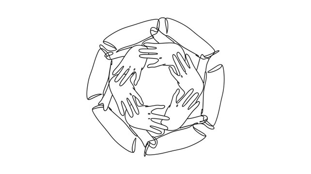 Diverse group of people joining hands in unity and cooperation.