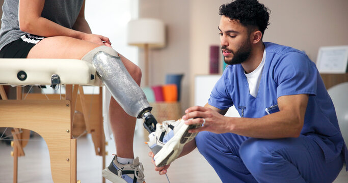 Nurse, amputee and leg with people, consultation and rehabilitation for person with disability. Healthcare, help or appointment for medical prosthetic, physical therapy or man with woman in clinic