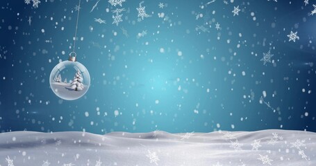 Hanging glass bauble showing mini pine trees over snowy field, with falling snowflakes, copy space © vectorfusionart