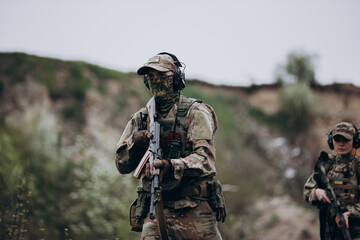 Fototapeta premium Ukrainian male and female soldiers practicing