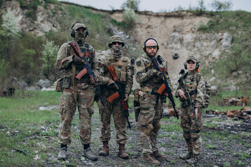 Fototapeta premium A group of four Ukrainian soldiers practicing at the range