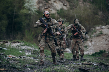 Fototapeta premium A group of Ukrainian militarymen patroling the territory
