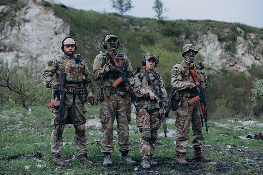 Portrait of Ukrainian militarymen with their rifles looking in the camera