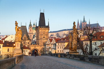 Fototapeta premium charles Bridge in Prague Czech Republic at sunrise with historic statues