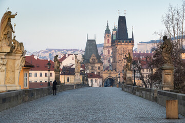 Fototapeta premium charles Bridge in Prague Czech Republic at sunrise with historic statues