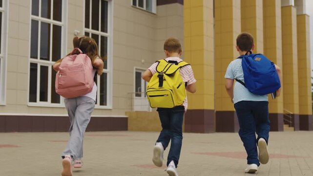 Young students arrive at school, Group of friends in morning rush, Colorful backpacks express individuality, School building ready for learning, Happy kids start the day, Fearless and curious about