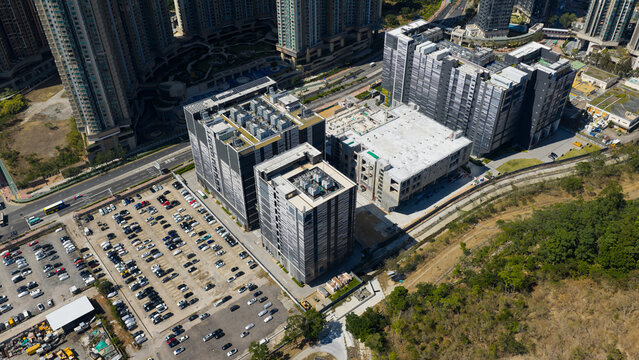 Aerial view of the Equinix Data Center complex featuring modern industrial buildings with rooftop cooling units and an adjacent parking lot New Territories, Hong Kong.
