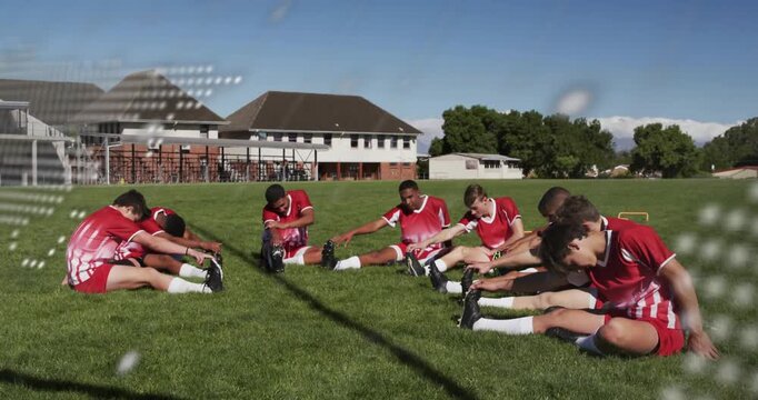 Sports team on-field stretching hamstring warming while dotted-map or console shifting revealing tea