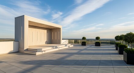 Naklejka premium Modern outdoor stage on a rooftop terrace with manicured trees and a scenic sky view