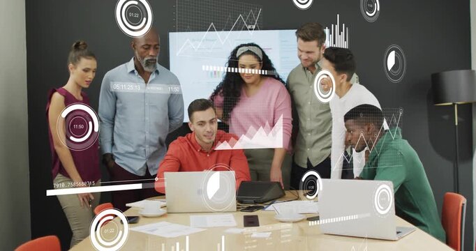 Seated man clicking laptop causing business team reviewing data charts, HUD animating graphs