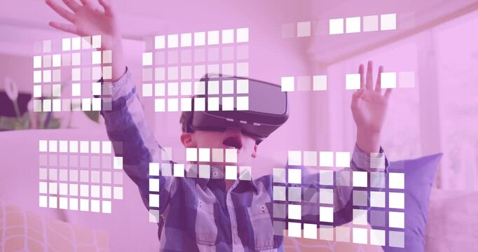 Boy on couch with VR headset gesturing to select virtual squares while grid animating for gaming