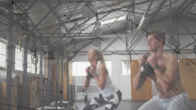 Fitness partners initiating goblet squats for training lowering and rising with kettlebell overlays
