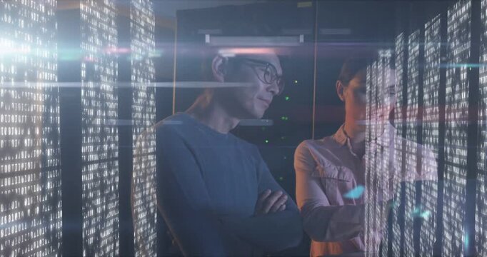 Woman tapping transparent display causing blue flares, man leaning in, troubleshooting servers